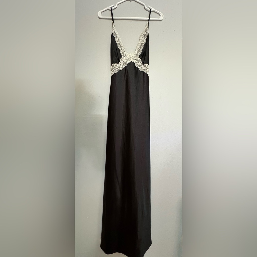 Black satin dress/white lace detail.The back is sexy with a criss-cross straps.
